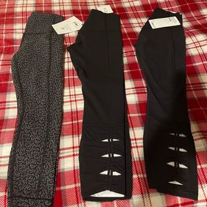 Theee pairs of Athleta women’s workout pants size xxs